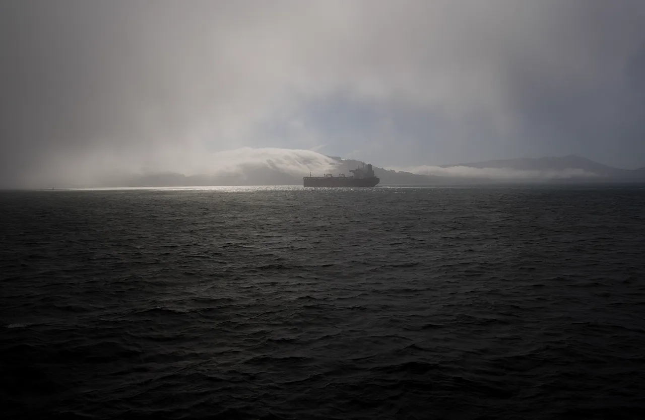 A ship half-hidden in the fog of the Bay