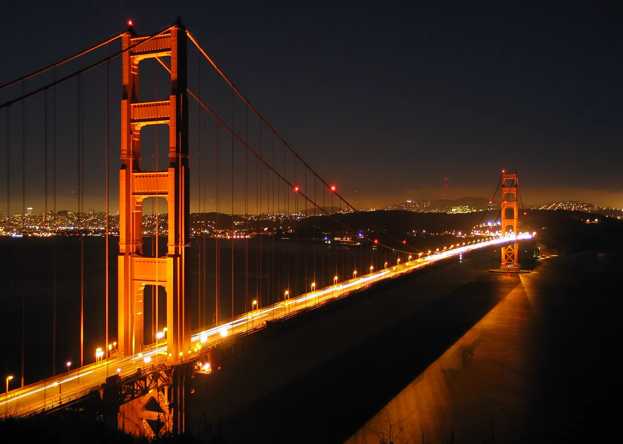 Golden Gate Bridge glowing at night